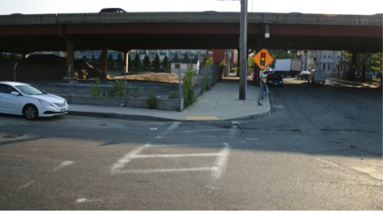 FIGURE 21. Beech Street at Spruce Street near US Route 1 Viaduct
Figure 21 shows Spruce Street passing under the US Route 1 viaduct. It also shows available space under the viaduct that could be used to build a ramp connector between Beech Street and the highway entrance on the far side of the Viaduct.