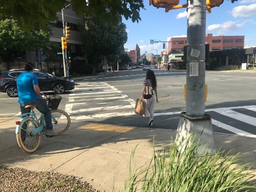 Figure 12
A bicyclist and pedestrian begin to cross the intersection after sharing sidewalk space while waiting for the pedestrian signal. Figure 12
A bicyclist and pedestrian begin to cross the intersection after sharing sidewalk space while waiting for the pedestrian signal.