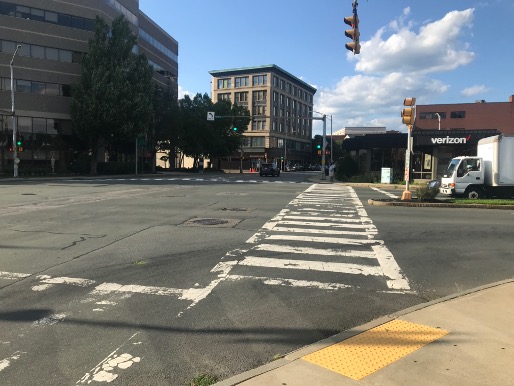 Figure 9
Apex curb ramp on the southwest corner of the intersection directing pedestrians into the middle of traffic instead of along the path of either crosswalk. Figure 9
Apex curb ramp on the southwest corner of the intersection directing pedestrians into the middle of traffic instead of along the path of either crosswalk.